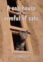 A cob house and an armful of cats cover